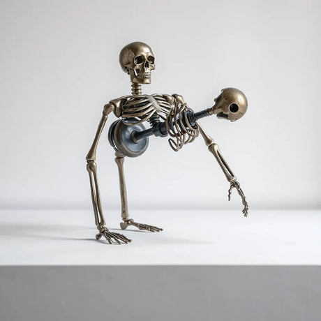 Metal skeleton doll with articulated joints displayed on a neutral tabletop under soft studio lighting