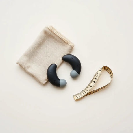 Discreet nipple stimulation devices arranged on a neutral surface with a measuring tape and soft cloth