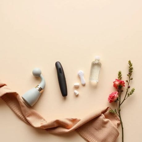 Discreet pleasure products and water-based lubricant arranged on a clean tabletop