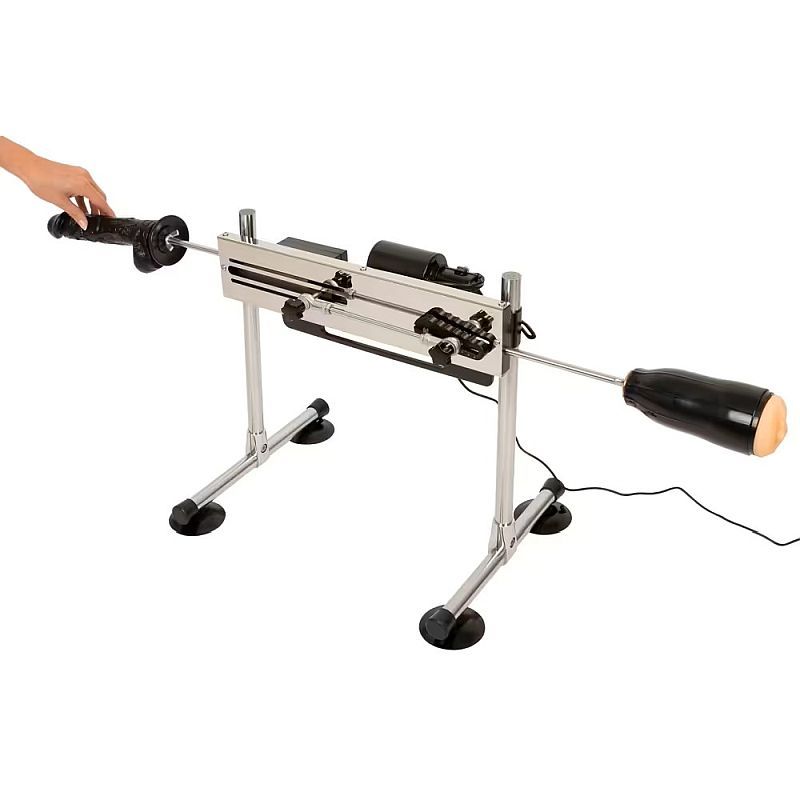 A dual-ended metal sex machine with two attachments on a stable frame with suction cup feet.