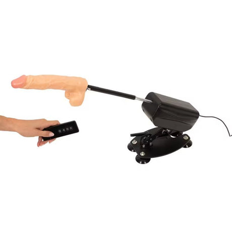 MixJoy sex machine with a flesh-colored dildo attachment, remote control, and suction cup base.