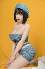 love doll sex toy wearing a blue denim outfit with a matching hat against an orange background