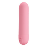 A pink, smooth-textured mini bullet vibrator with a power button on its rounded base.