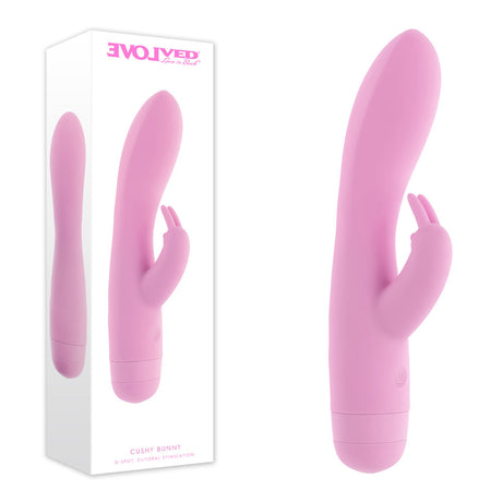 Evolved Cushy Bunny pink USB rechargeable rabbit vibrator shown next to its product packaging.