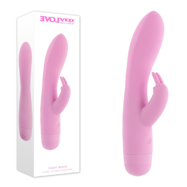 Evolved Cushy Bunny pink USB rechargeable rabbit vibrator shown next to its product packaging.