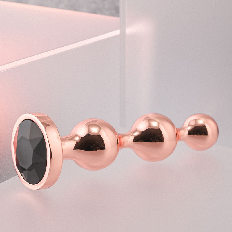 Gender X GOLD DIGGER SMALL - Rose Gold Small Butt Plug with Black Gem Base - Naughty by Nature Adult Store