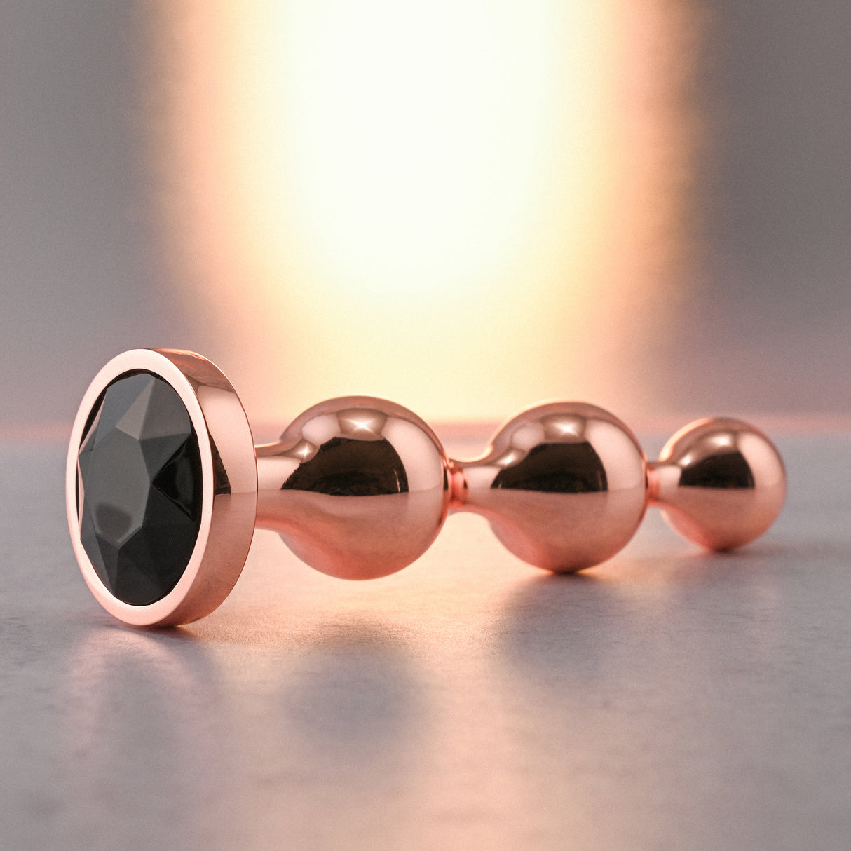 Gender X GOLD DIGGER SMALL - Rose Gold Small Butt Plug with Black Gem Base - Naughty by Nature Adult Store