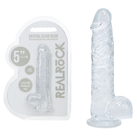 Clear silicone dildo with packaging labeled 'Real Rock' on a white background