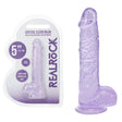 Crystal clear dildo with suction cup on a white background