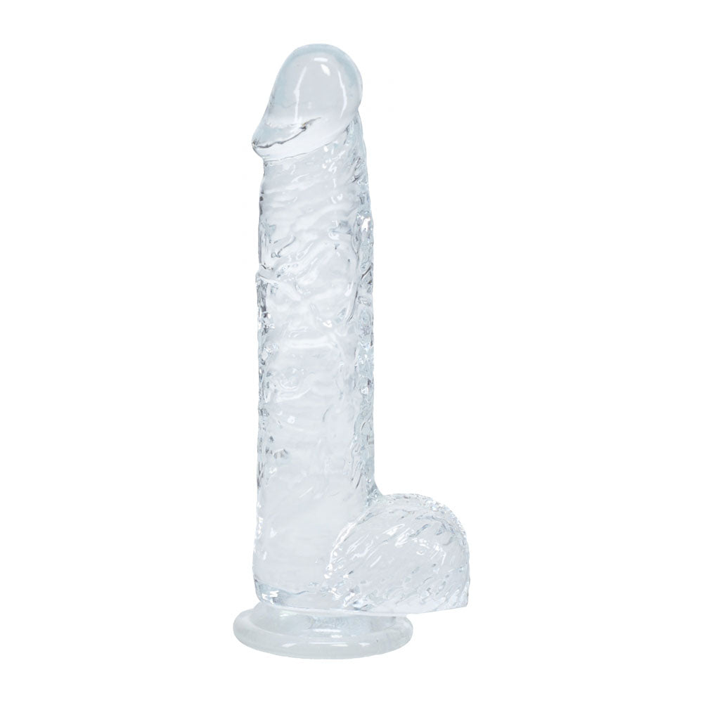 Clear silicone butt plug on a white background